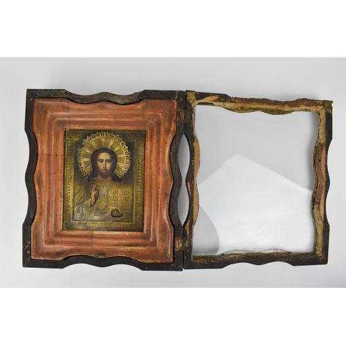 175 - A 19th century Russian icon of Christ Pantocrator, with gilt metal oklad, encased in a glazed shaped... 