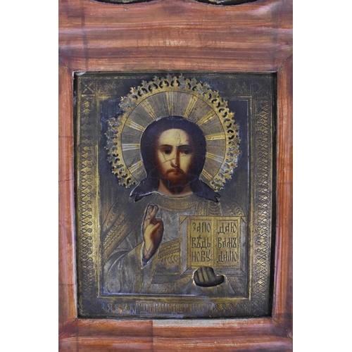 175 - A 19th century Russian icon of Christ Pantocrator, with gilt metal oklad, encased in a glazed shaped... 