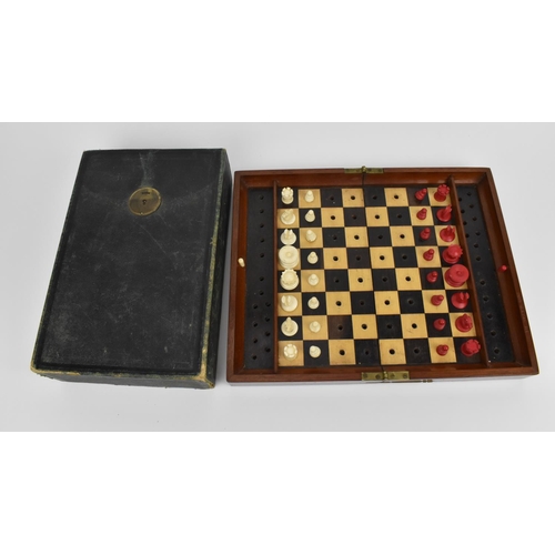 178 - A late 19th/early 20th century Jacques & Sons travelling chess set, with carved bone pieces on a mar... 