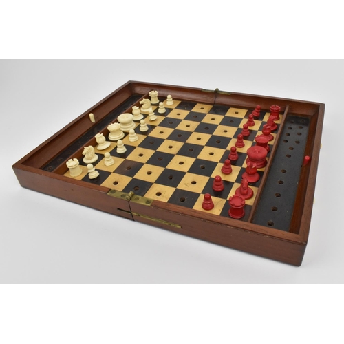 178 - A late 19th/early 20th century Jacques & Sons travelling chess set, with carved bone pieces on a mar... 