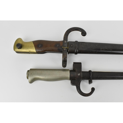 183 - A late 19th century French Third Republic Lebel Epee Bayonet with brass mounted wooden grip, three s... 