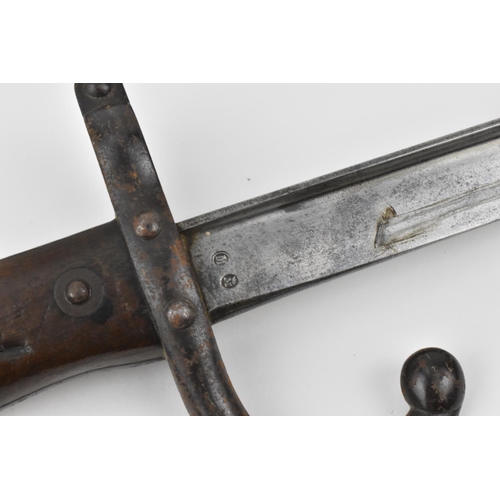 183 - A late 19th century French Third Republic Lebel Epee Bayonet with brass mounted wooden grip, three s... 