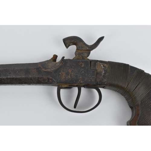 186 - A 19th century percussion pistol with spring bayonet, octagonal barrel, and wooden grip, 31.5 cm lon... 