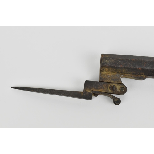 186 - A 19th century percussion pistol with spring bayonet, octagonal barrel, and wooden grip, 31.5 cm lon... 