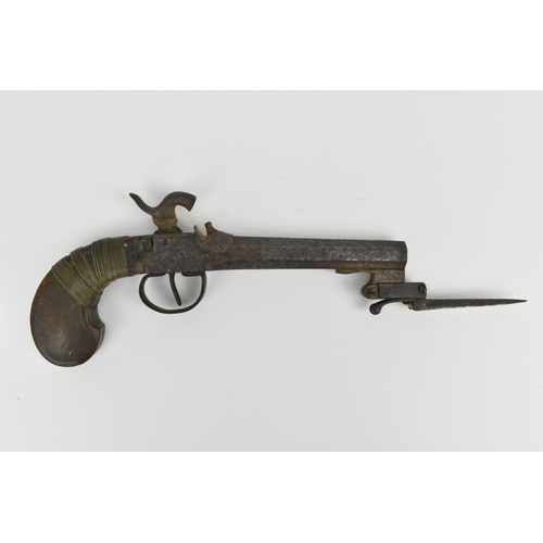 186 - A 19th century percussion pistol with spring bayonet, octagonal barrel, and wooden grip, 31.5 cm lon... 