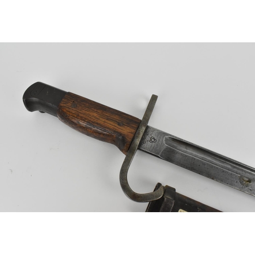 187 - A Japanese WW2 Arisaka type 30 bayonet, with original metal scabbard, with steel hook quillon and mu... 