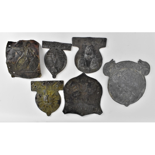 195 - A collection of six 19th century and later fire marks / insurance plaques, to include one for Manche... 