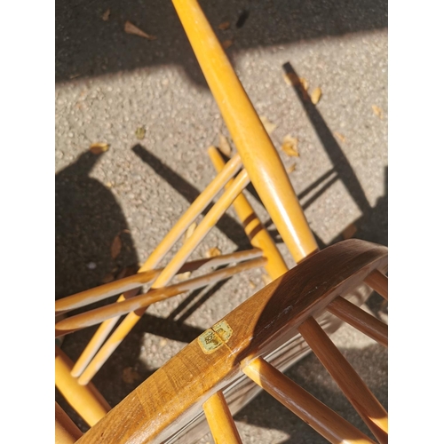 199 - A blonde elm Ercol drop leaf circular dining table, together with six candlestick lattice beech and ... 