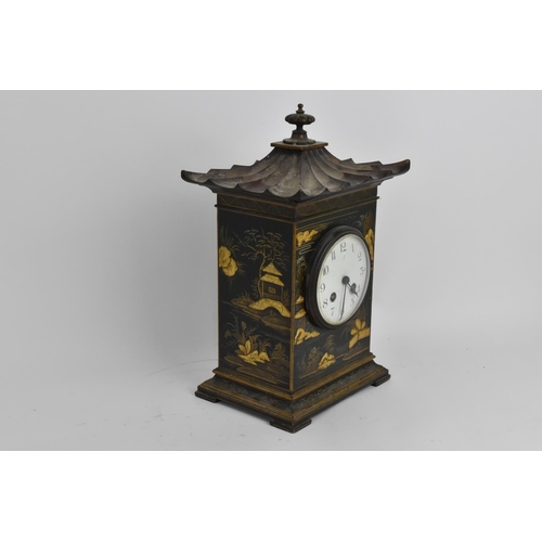 64 - An early 20th century Japanned mantle clock in the form of a pagoda having an enamel dial with Arabi... 