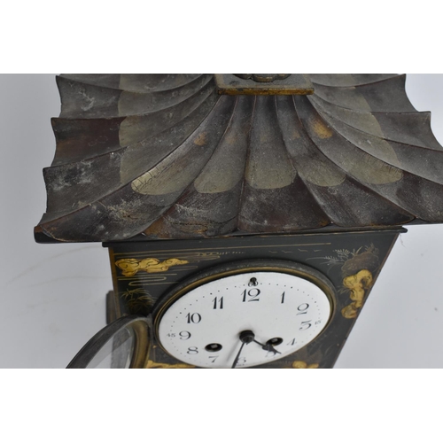 64 - An early 20th century Japanned mantle clock in the form of a pagoda having an enamel dial with Arabi... 