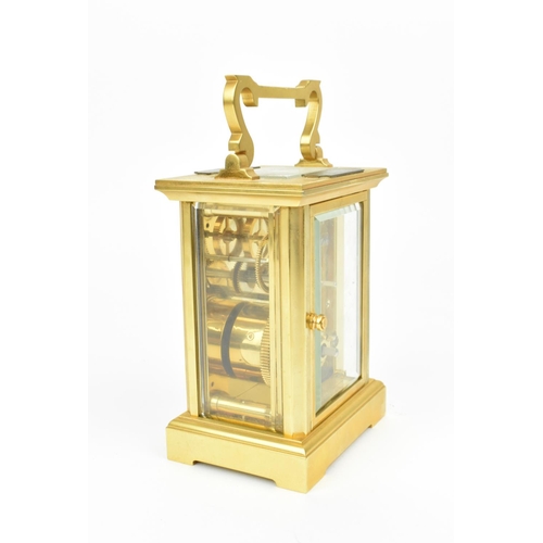 68 - A late 20th century brass cased carriage clock having a white enamel dial with Roman numerals, Bregu... 