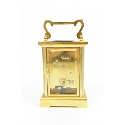 68 - A late 20th century brass cased carriage clock having a white enamel dial with Roman numerals, Bregu... 