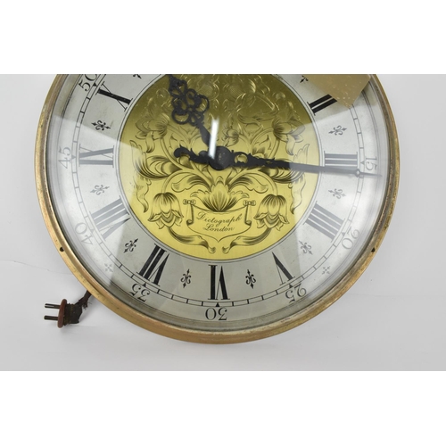 69 - A pair of Magneta Impulse Movement slave clocks, having 12 inch dials with floral engraved centres, ... 