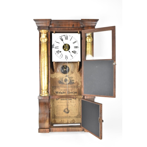 71 - A late 19th century Seth Thomas rosewood cased wall hanging clock. The dial flanked by two gilt pain... 