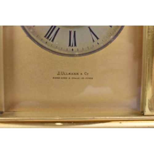 215 - A J. Ullmann & Co. Brass cased repeating and striking carriage clock having a silvered ring dial wit... 