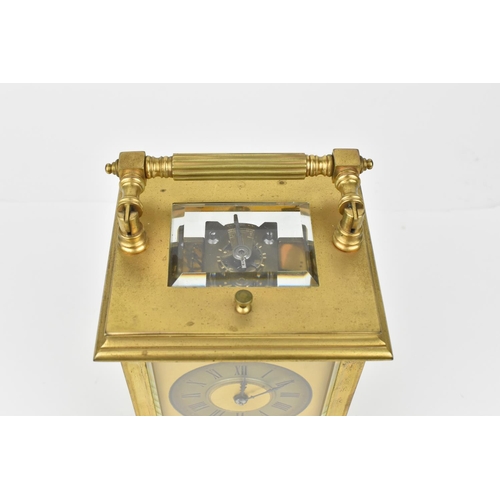 215 - A J. Ullmann & Co. Brass cased repeating and striking carriage clock having a silvered ring dial wit... 