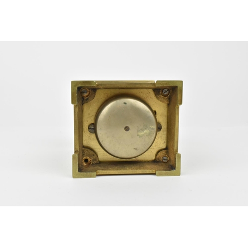 216 - A French brass cased carriage clock with alarm. Supported by four columns. Having a white enamel dia... 