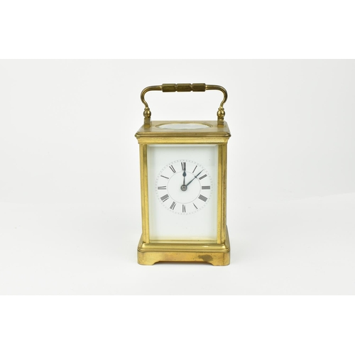 217 - A French brass cased striking carriage clock. With white enamel dial having Roman numerals. Approx 1... 