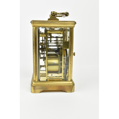 217 - A French brass cased striking carriage clock. With white enamel dial having Roman numerals. Approx 1... 