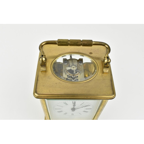 217 - A French brass cased striking carriage clock. With white enamel dial having Roman numerals. Approx 1... 