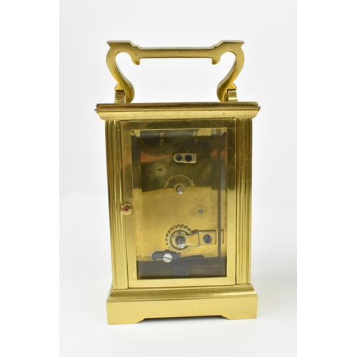 221 - A pair of brass cased carriage clocks with enamel dials and having Roman numerals. One stamped 1858,... 