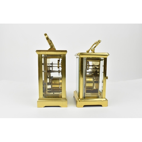 221 - A pair of brass cased carriage clocks with enamel dials and having Roman numerals. One stamped 1858,... 