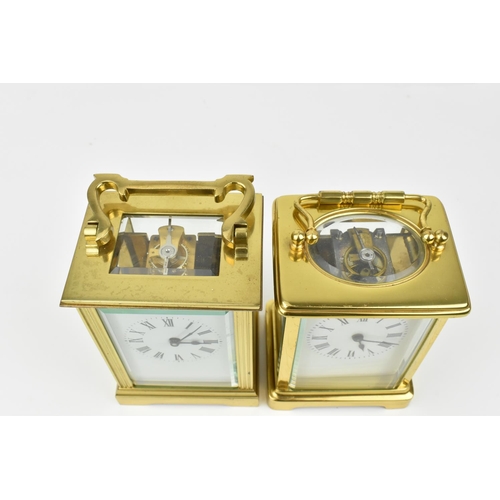 221 - A pair of brass cased carriage clocks with enamel dials and having Roman numerals. One stamped 1858,... 