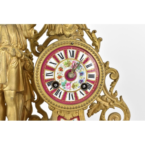 222 - A early 20th century three piece spelter and porcelain mantel clock set. Comprising, a central mante... 