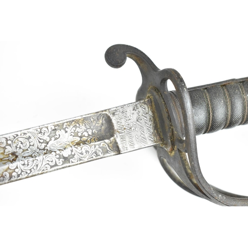 180 - A Victorian Officer's sword, with original metal scabbard, pierced basket and shagreen grip, the bla... 