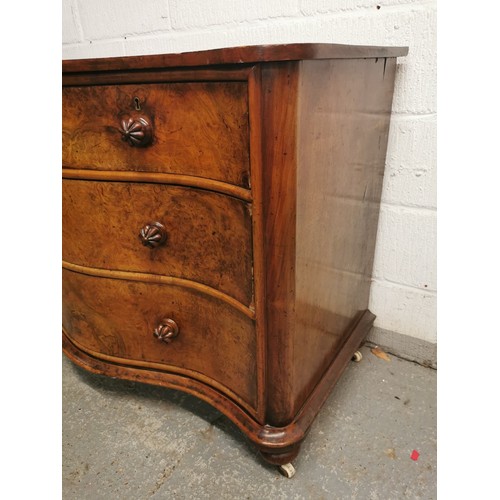 171 - A Victorian serpentine front walnut chest of drawers, with two short drawers above two long, each bu... 