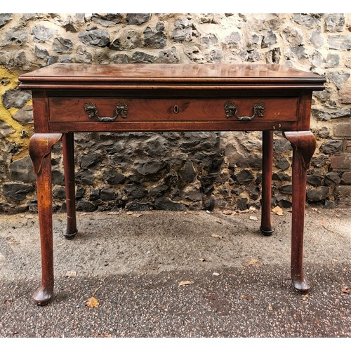 173 - A George III mahogany fold over tea table, with twin handled single frieze drawer, supported on four... 