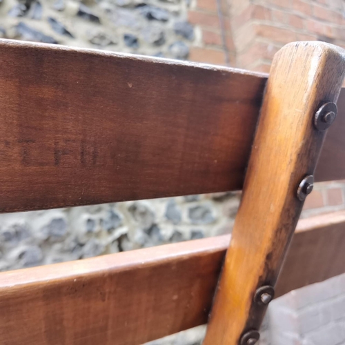 225 - Cowra Military Camp - A Second World War mahogany 3 seat folding campaign bench. Stamped to the back... 