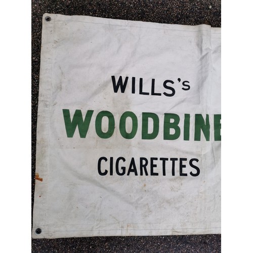 193 - A very large Wills Woodbine Sun Visa tobacco advertising banner on canvas, 287 cm wide x 90 cm high