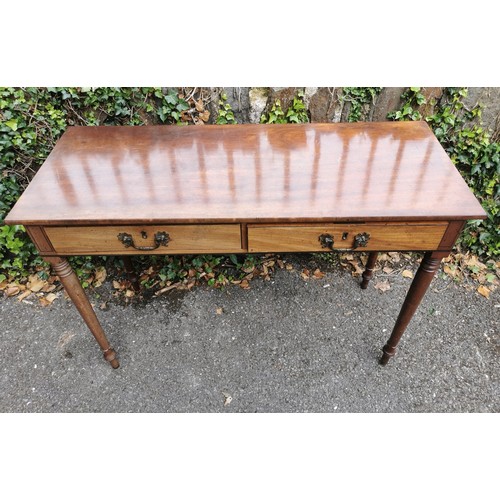 172 - A Victorian mahogany writing table, of rectangular form with two frieze drawers, supported on four t... 