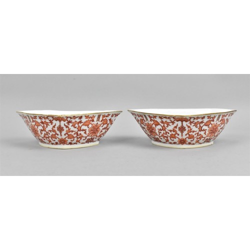 64 - A pair of Chinese Daoguang period. shaped dishes, each with gilt rim and iron red foliate scrolls th... 