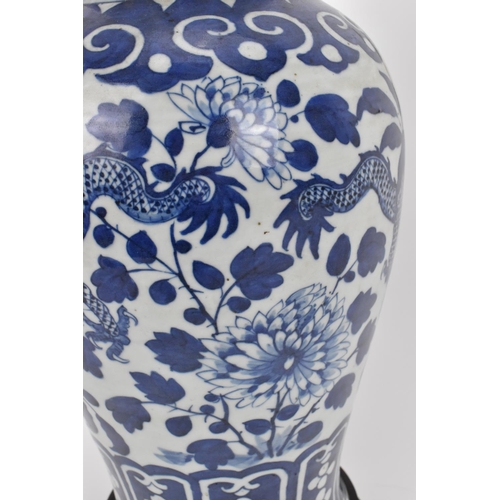 68 - A pair of Chinese Qing dynasty blue and white porcelain lidded vases, 19th century, of baluster shap... 