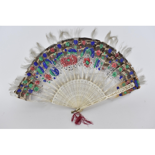 101A - A Chinese Qing Dynasty ivory fan with painted feathers, fretworked sticks and guards, 27cm h, contai... 