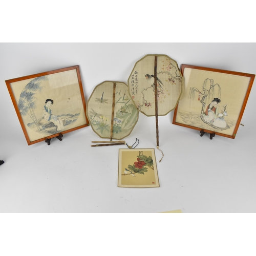 104A - A pair of Japanese 20th century watercolours on silk, one of a woman sat on a rock in a landscape, a... 