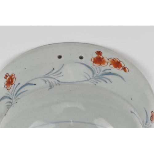 105 - A late 18th century Japanese Imari bleeding / shaving bowl, with a central floral composition in a v... 