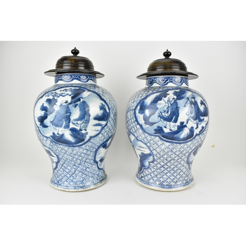111 - A pair of Chinese Qing dynasty blue and white porcelain vases, 18th century of baluster shape with a... 