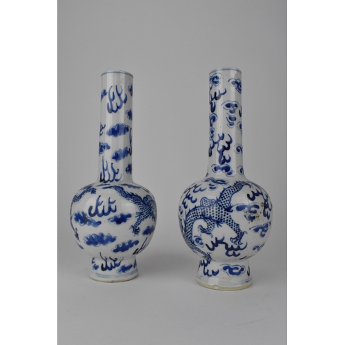 113 - A near pair of Chinese Qing dynasty blue and white bottle vases, late 19th century each, decorated w... 