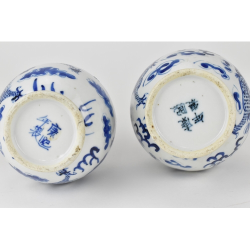 113 - A near pair of Chinese Qing dynasty blue and white bottle vases, late 19th century each, decorated w... 