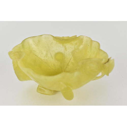 117 - A Chinese yellow/pale green jade bowl, fashioned as a leaf and other plants, 4.5cm high, 8.5cm wide ... 