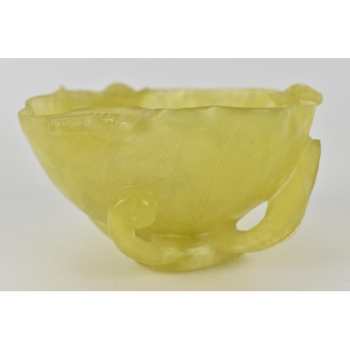 117 - A Chinese yellow/pale green jade bowl, fashioned as a leaf and other plants, 4.5cm high, 8.5cm wide ... 