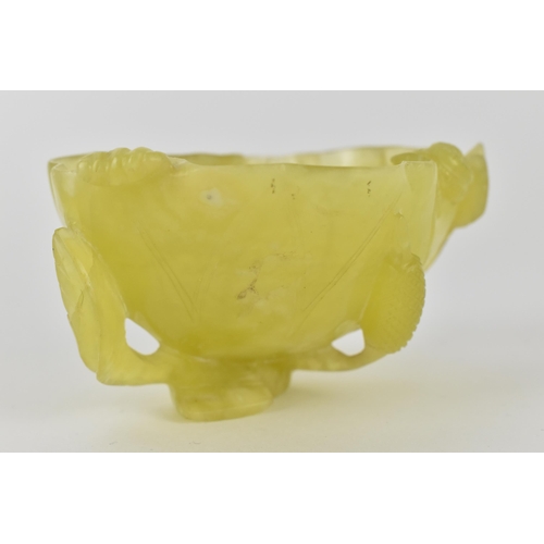 117 - A Chinese yellow/pale green jade bowl, fashioned as a leaf and other plants, 4.5cm high, 8.5cm wide ... 