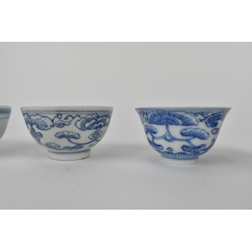 118 - Six Chinese Qing dynasty blue and white tea bowls, 19th/20th century, four decorated with flowers, o... 