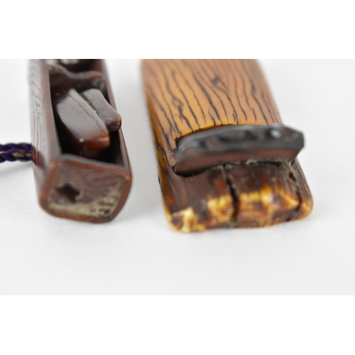 122 - Two Japanese 19th century stained ivory netsuke, one a woodworking plane with text to the underside ... 