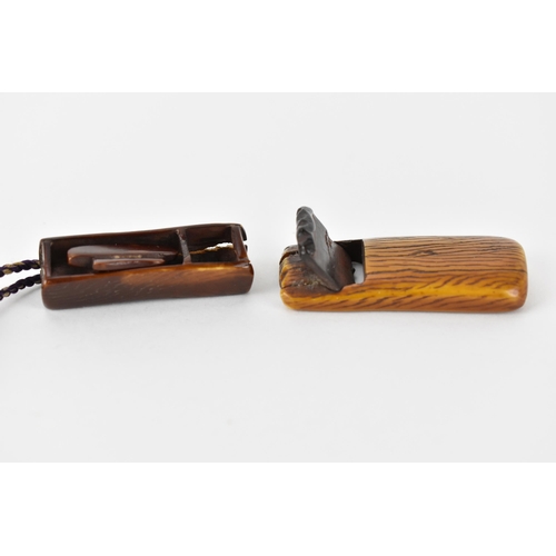 122 - Two Japanese 19th century stained ivory netsuke, one a woodworking plane with text to the underside ... 