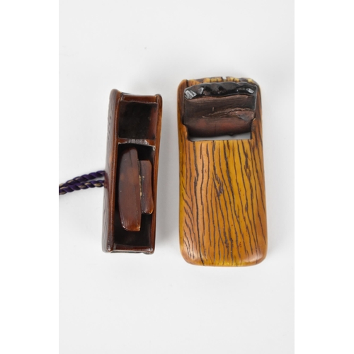 122 - Two Japanese 19th century stained ivory netsuke, one a woodworking plane with text to the underside ... 