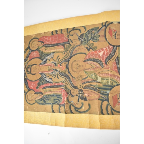 129 - A Chinese Qing Dynasty ancestral portraits, 18th/19th century, mounted as a scroll of men and women,... 